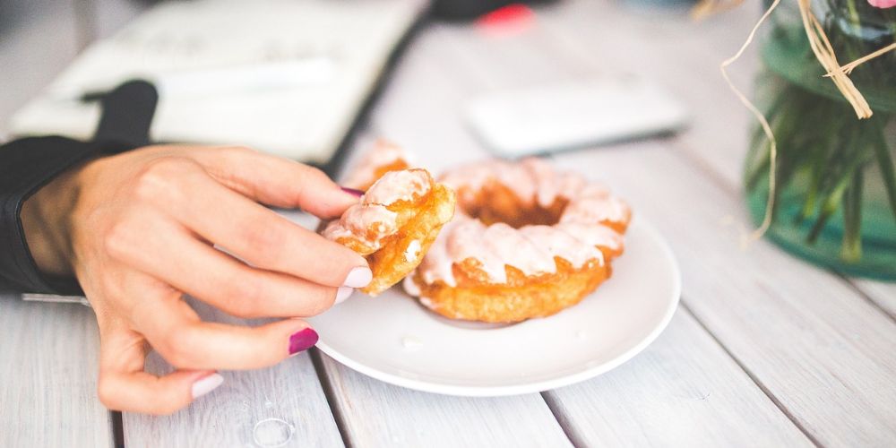 Delicious homemade glazed donut on a white plate
